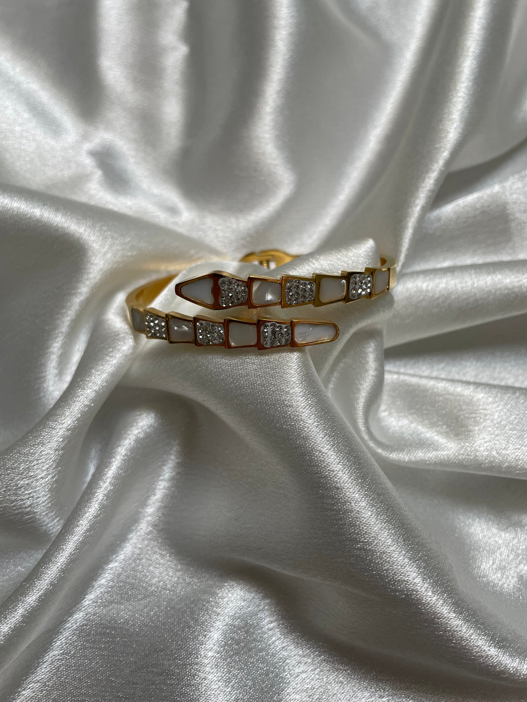 Serpent-inspired gold bracelet