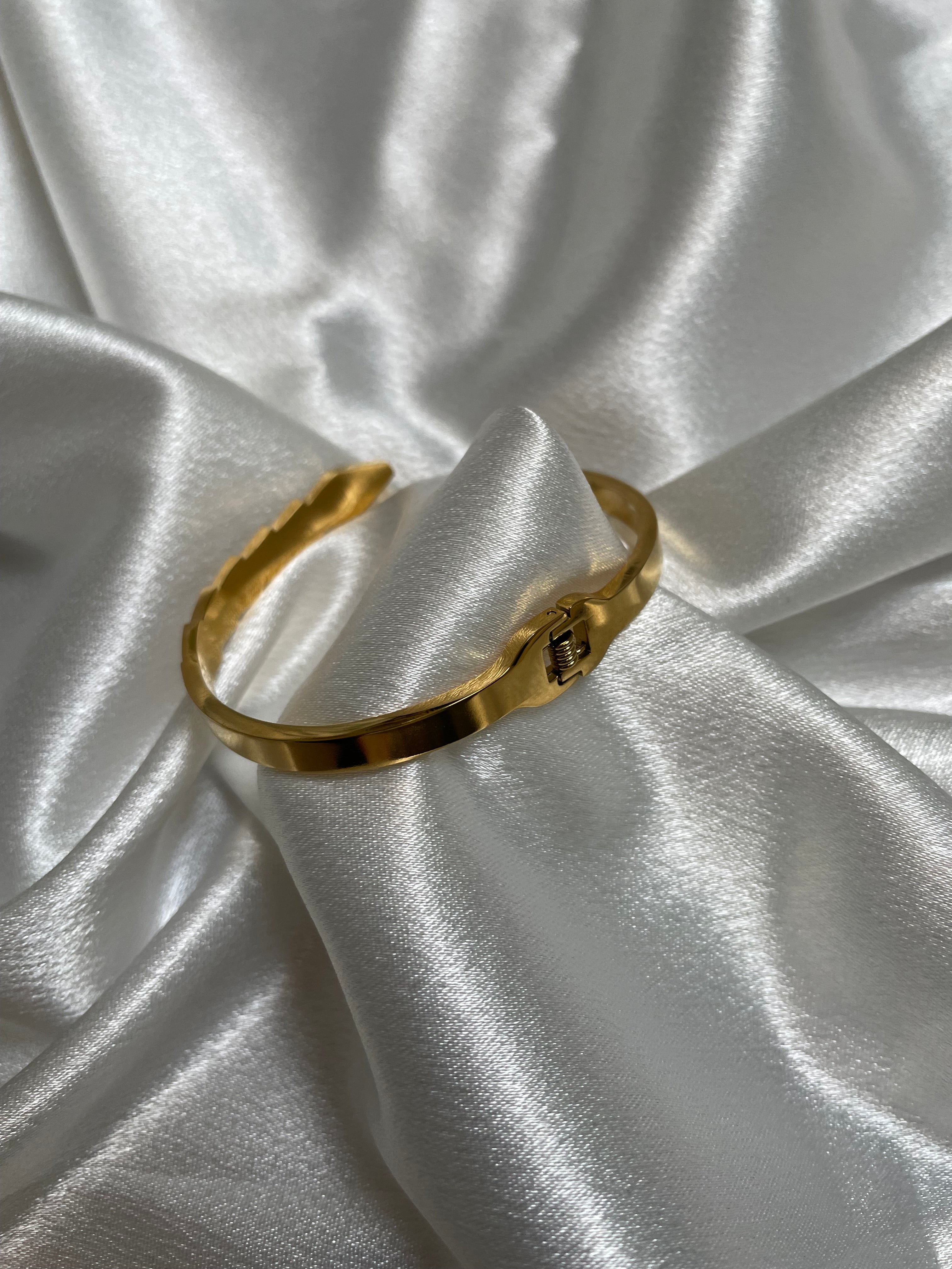 Serpent-inspired gold bracelet